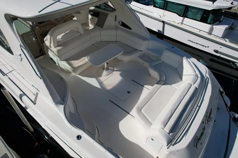 Slide: The Image of Luxurious 2001 Sea Ray 540 Sundancer yacht with spacious white seating area. - 73