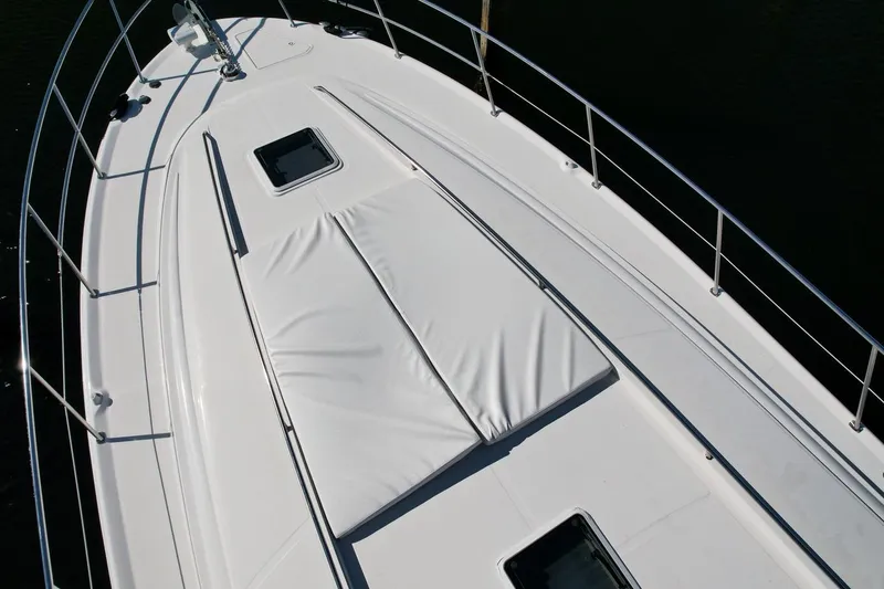 Slide: The Image of 2001 Sea Ray 540 Sundancer yacht deck with sunpad and railing. - 76