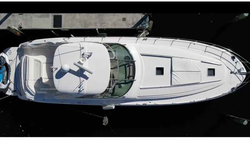 Slide: The Image of Overhead view of a 2001 Sea Ray 540 Sundancer yacht docked at a marina. - 79