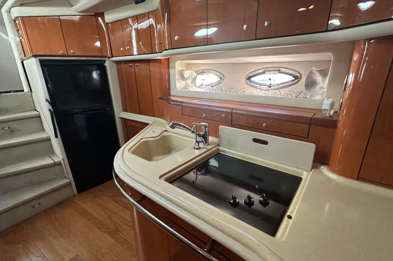 Slide: The Image of Luxurious kitchen area in 2001 Sea Ray 540 Sundancer yacht with modern amenities. - 8
