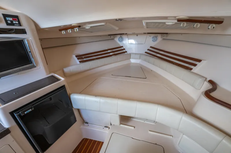 Slide: The Image of 2005 Grady-White Express 330 cabin interior with seating and storage. - 33