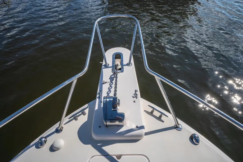 Slide: The Image of 2005 Grady-White Express 330 boat bow with anchor chain on water. - 36
