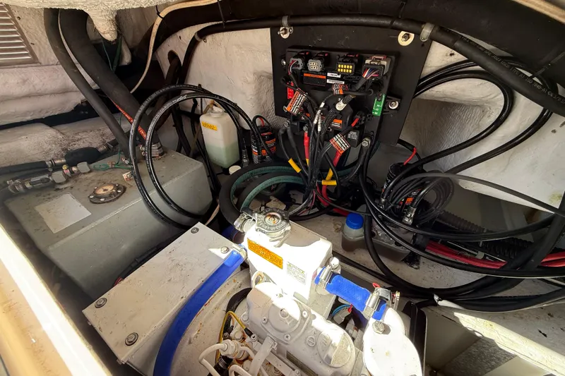 Slide: The Image of Engine compartment of a 2005 Grady-White Express 330 boat, showing wiring and components. - 38