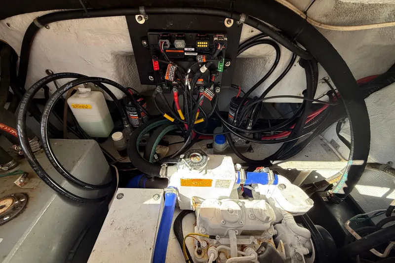 Slide: The Image of Engine compartment of a 2005 Grady-White Express 330 boat, showing wiring and components. - 39