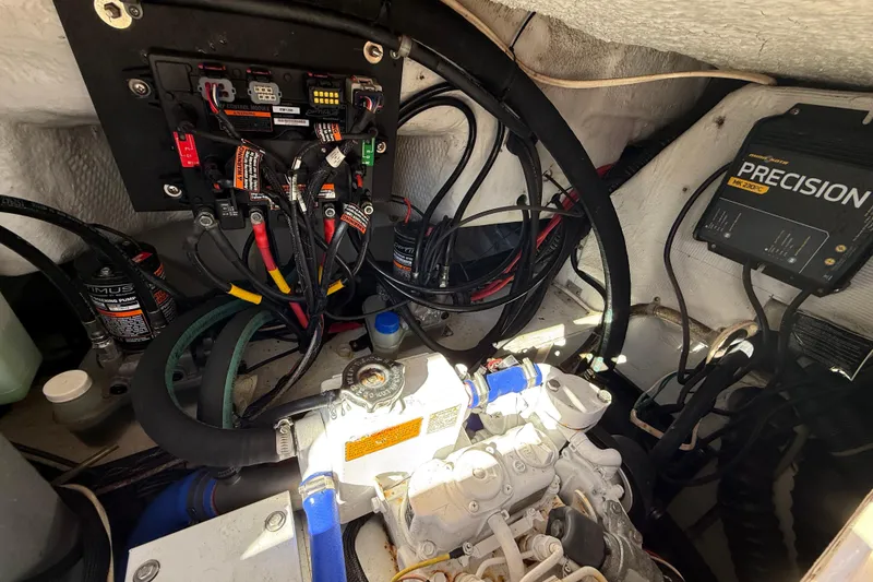 Slide: The Image of Engine compartment of a 2005 Grady-White Express 330 boat, showing wiring and components. - 40