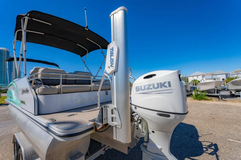 Slide: The Image of 2021 Silver Wave 2410 SW5 JS boat with Suzuki engine, parked outdoors. - 15
