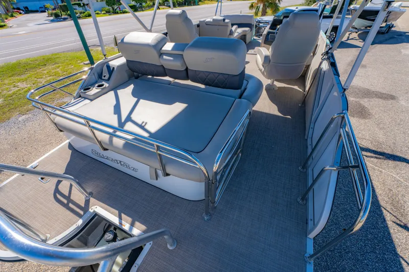 Slide: The Image of 2021 Silver Wave 2410 SW5 JS pontoon boat interior with plush seating and sleek design. - 19