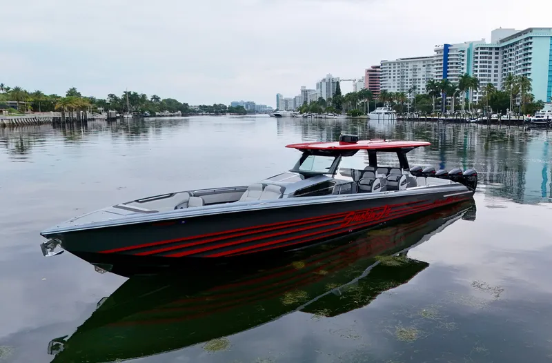 Slide: The Image of 2022 Nor-Tech 50 Sport boat on calm water, cityscape background. - 44