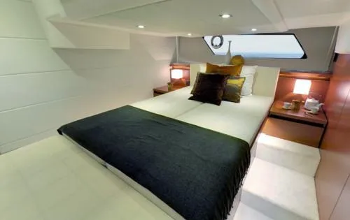 Slide: The Image of Luxurious bedroom interior of 2016 Prestige 450 S yacht with modern decor and ambient lighting. - 10
