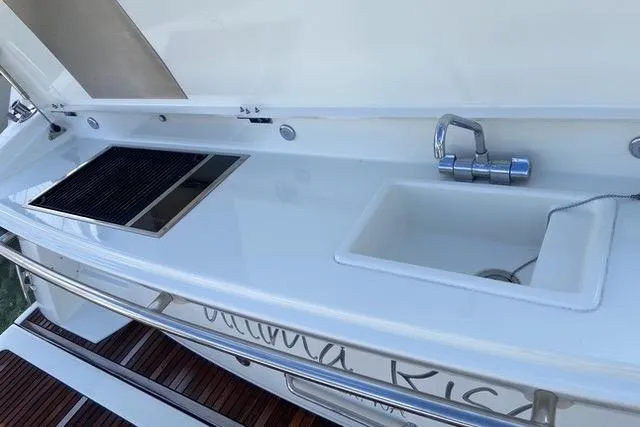 Slide: The Image of Outdoor kitchen on a 2016 Prestige 450 S yacht with sink and grill. - 23