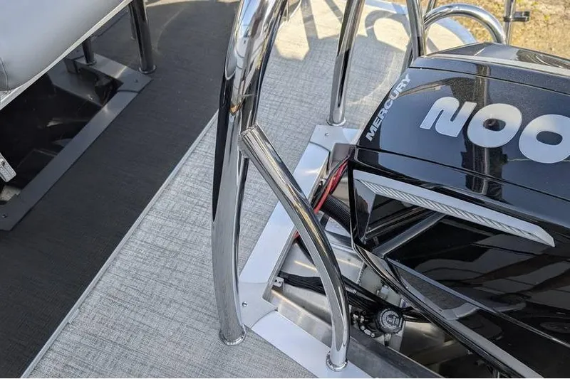 Slide: The Image of 2025 Avalon 2385 LSZ CRUISE boat with Mercury engine, chrome railings, and textured flooring. - 10