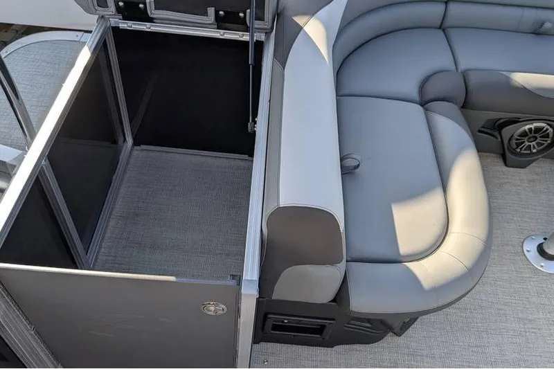 Slide: The Image of 2025 Avalon 2385 LSZ CRUISE boat interior with gray seating and storage area. - 12