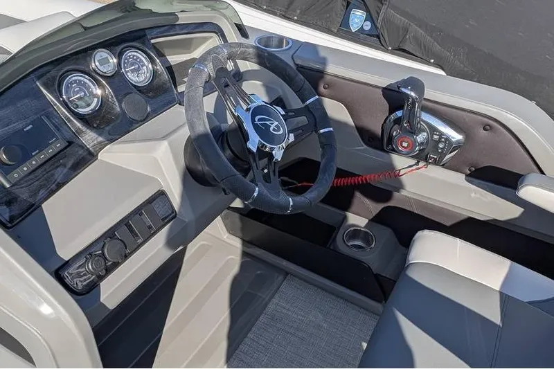 Slide: The Image of Steering console of 2025 Avalon 2385 LSZ Cruise boat with modern controls and gauges. - 14