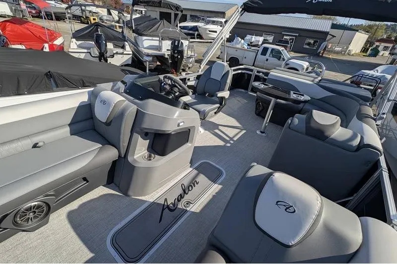 Slide: The Image of 2025 Avalon 2385 LSZ CRUISE pontoon boat interior with luxurious seating and helm. - 17