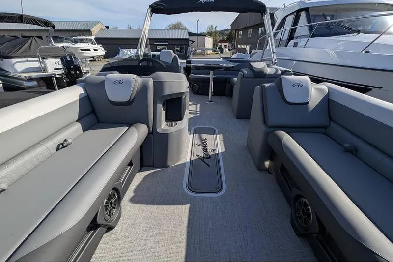 Slide: The Image of 2025 Avalon 2385 LSZ Cruise pontoon boat interior with luxurious seating and modern design. - 18