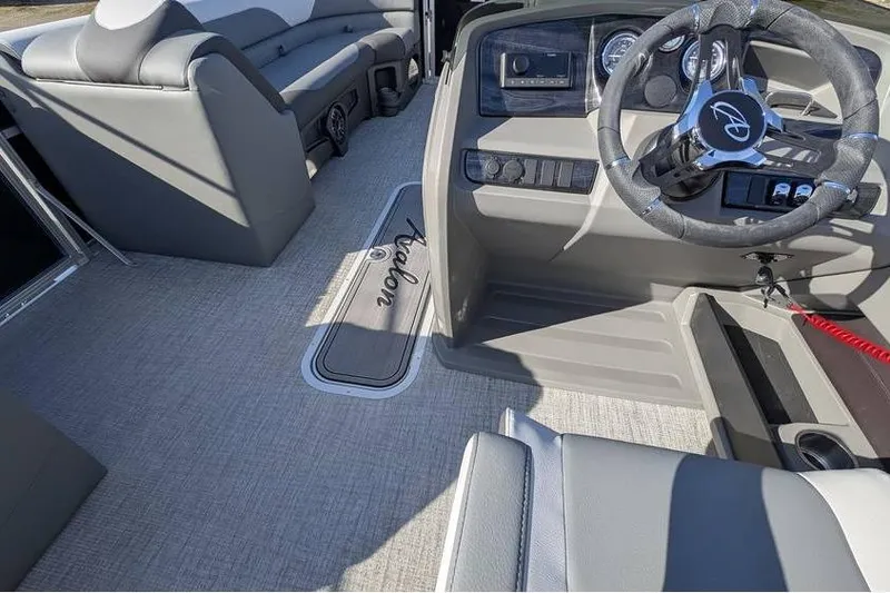Slide: The Image of Interior of 2025 Avalon 2385 LSZ Cruise boat with modern steering and seating. - 21