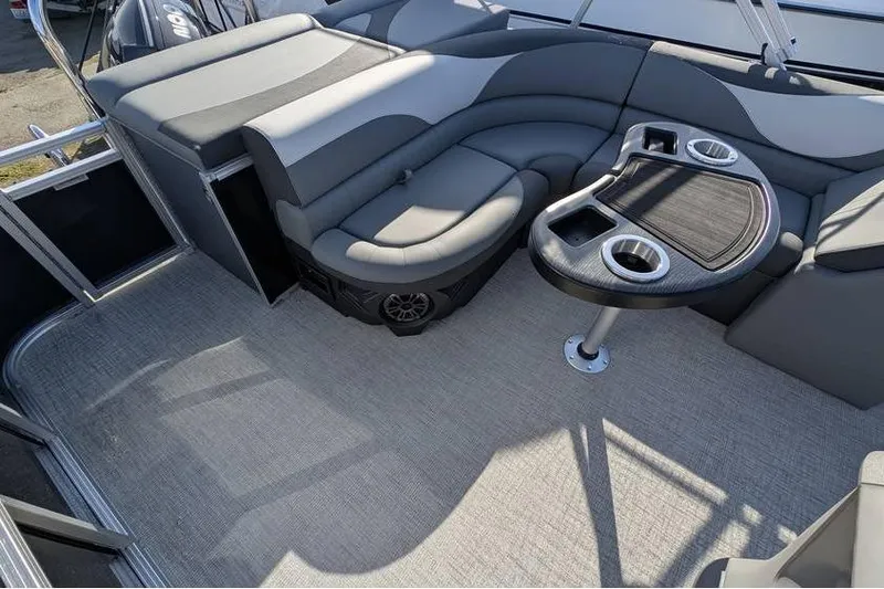 Slide: The Image of 2025 Avalon 2385 LSZ CRUISE boat interior with plush seating and table. - 22