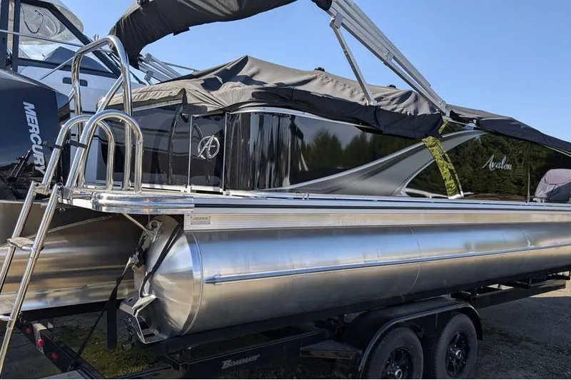 Slide: The Image of 2025 Avalon 2385 LSZ Cruise pontoon boat with sleek design and covered top. - 3
