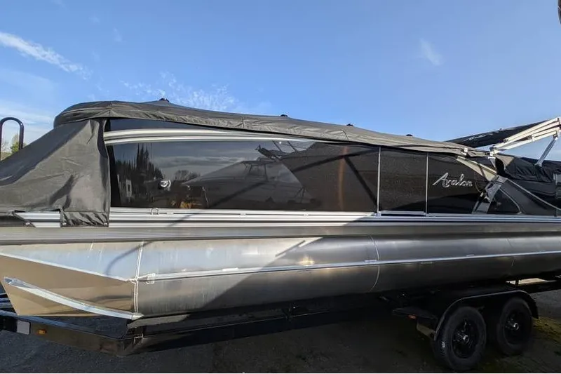 Slide: The Image of 2025 Avalon 2385 LSZ Cruise pontoon boat with cover on trailer. - 6