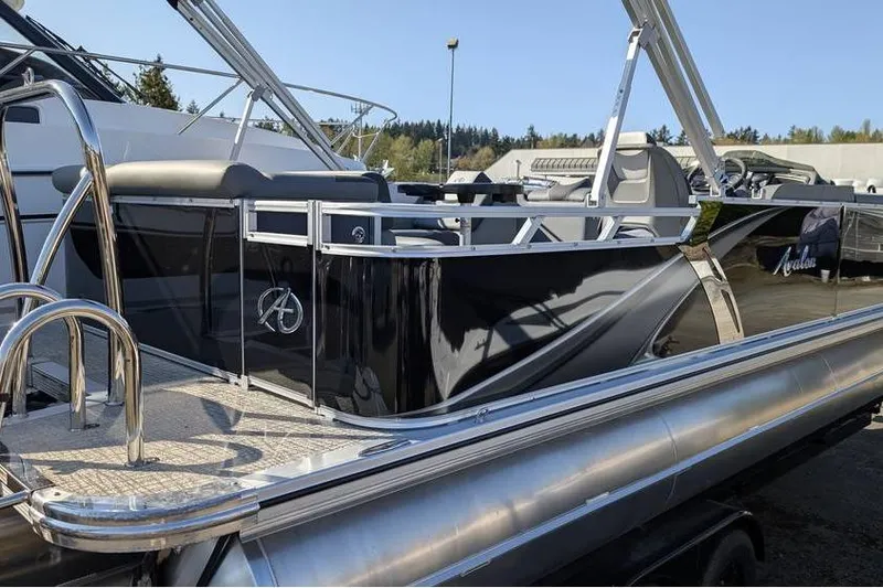 Slide: The Image of 2025 Avalon 2385 LSZ Cruise pontoon boat with sleek black design and modern features. - 8