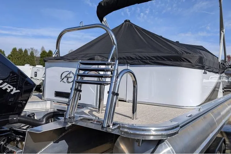 Slide: The Image of 2025 Avalon 2585 LSZ Entertainer boat with ladder and covered deck. - 4