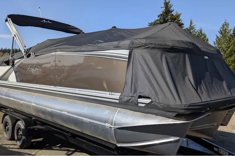 Slide: The Image of 2025 Avalon 2585 LSZ Entertainer pontoon boat with cover on trailer. - 8