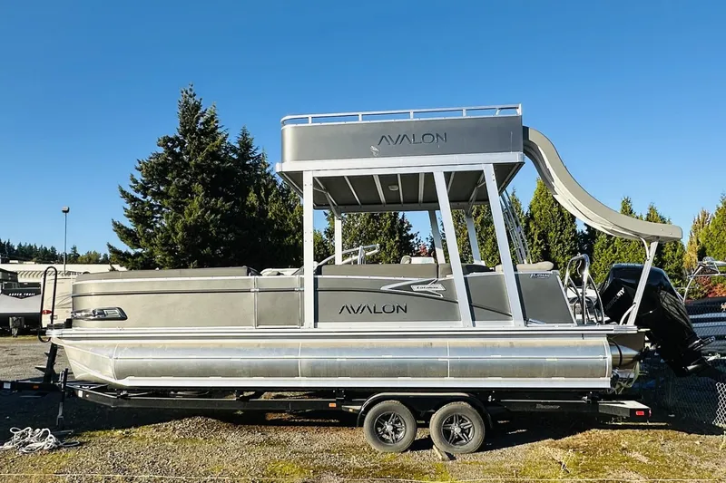 The Image of 2025 Avalon Catalina Cruise Funship pontoon boat with slide, parked on trailer. - 1