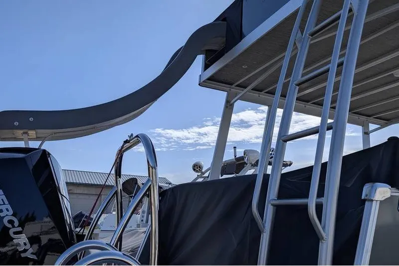 Slide: The Image of 2025 Avalon Catalina Cruise Funship with slide and ladder under a clear sky. - 3