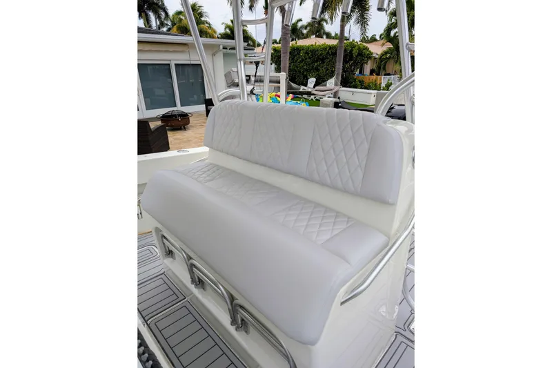Slide: The Image of 2017 SeaVee 390Z boat with white cushioned seating and diamond stitching. - 8