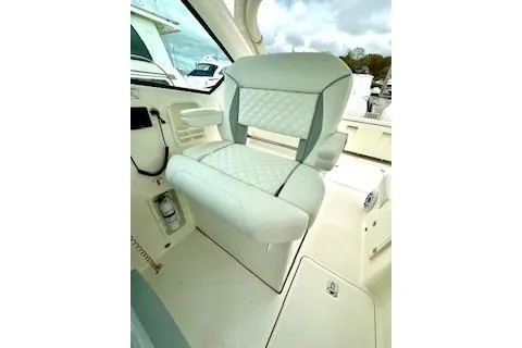 Slide: The Image of 2024 Pursuit DC 326 Dual Console boat seat with quilted upholstery. - 11