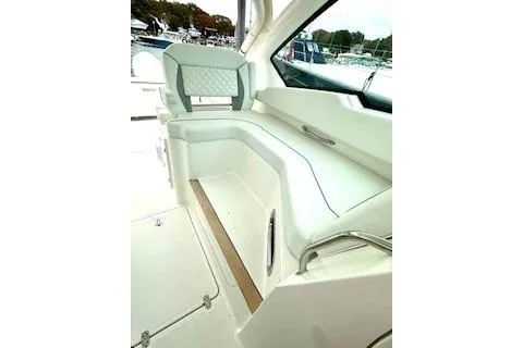 Slide: The Image of 2024 Pursuit DC 326 Dual Console interior seating with elegant design and spacious layout. - 12