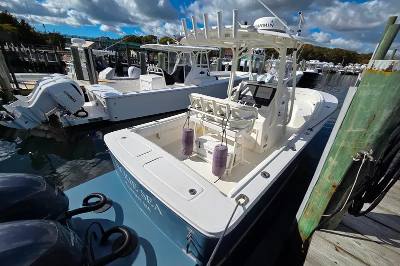 Slide: The Image of 2014 Regulator 25 boat docked with Yamaha engines and Garmin equipment. - 4