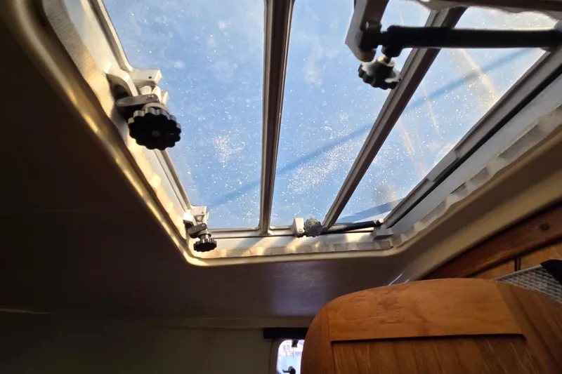 Slide: The Image of Interior view of 1988 Pearson 362 Centerboard sailboat hatch with clear sky above. - 24