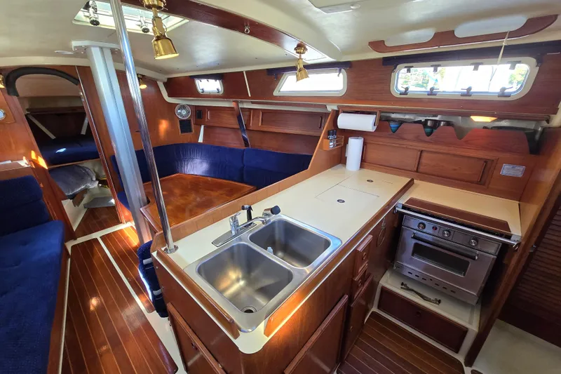 Slide: The Image of Interior of 1988 Pearson 362 Centerboard sailboat with kitchen and seating area. - 8