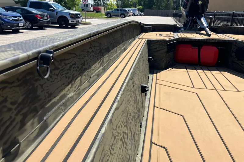 Slide: The Image of 2026 Tracker Grizzly 1650 T Prairie Wings Edition boat interior with camouflage design. - 10