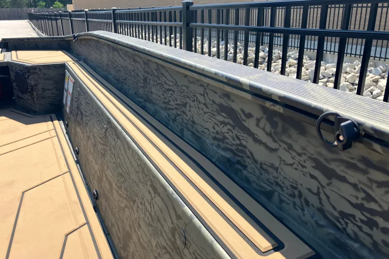 Slide: The Image of 2026 Tracker Grizzly 1650 T Prairie Wings Edition boat interior with camouflage design. - 11