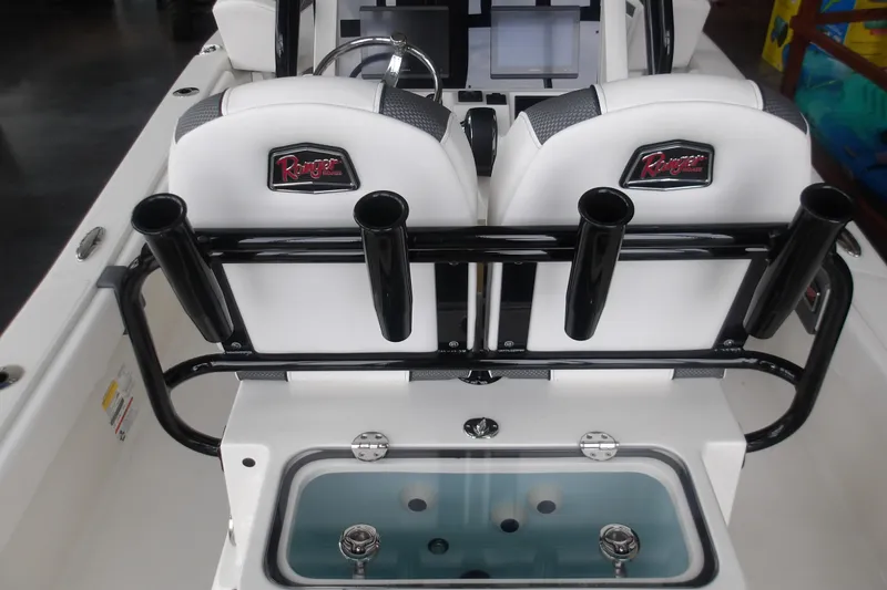 Slide: The Image of 2026 Ranger 2510 Bay boat interior with rod holders and livewell. - 13