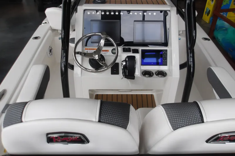 Slide: The Image of Interior view of 2026 Ranger 2510 Bay boat cockpit with modern controls and steering wheel. - 14