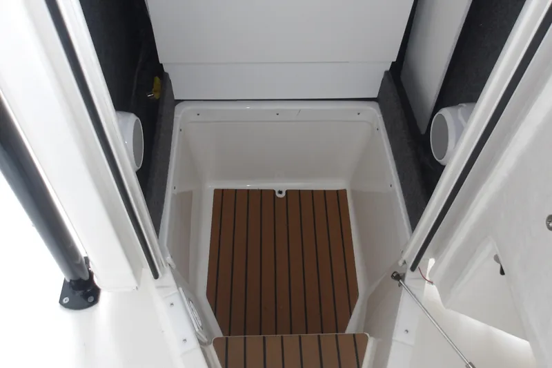 Slide: The Image of Interior view of 2026 Ranger 2510 Bay boat with wood-patterned flooring. - 18