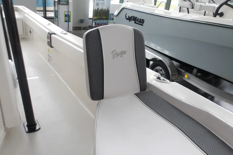 Slide: The Image of 2026 Ranger 2510 Bay boat interior with cushioned seating and sleek design. - 21