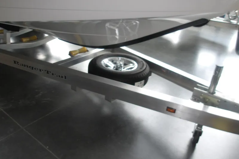 Slide: The Image of 2026 Ranger 2510 Bay boat on Ranger Trail trailer, showcasing sleek design and sturdy construction. - 22