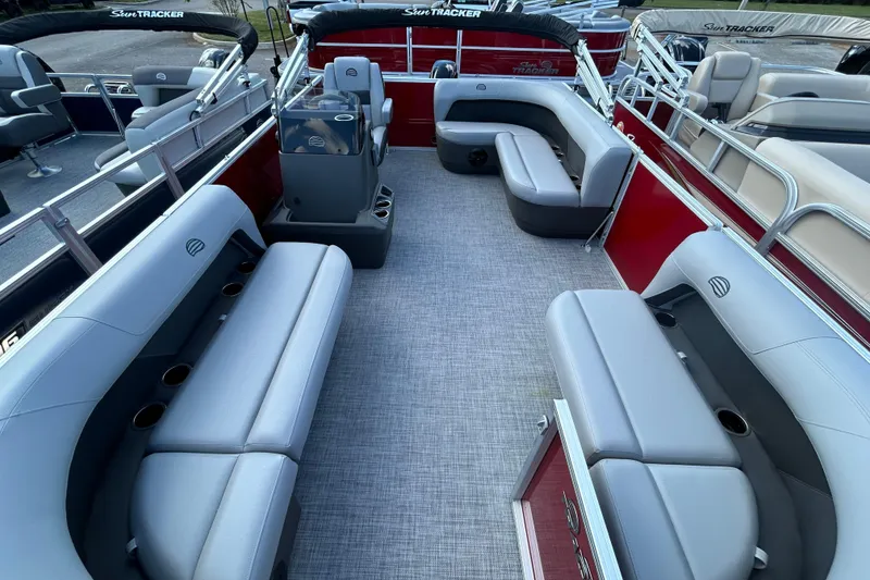Slide: The Image of 2026 Sun Tracker Party Barge 16 DLX interior with spacious seating and modern design. - 2