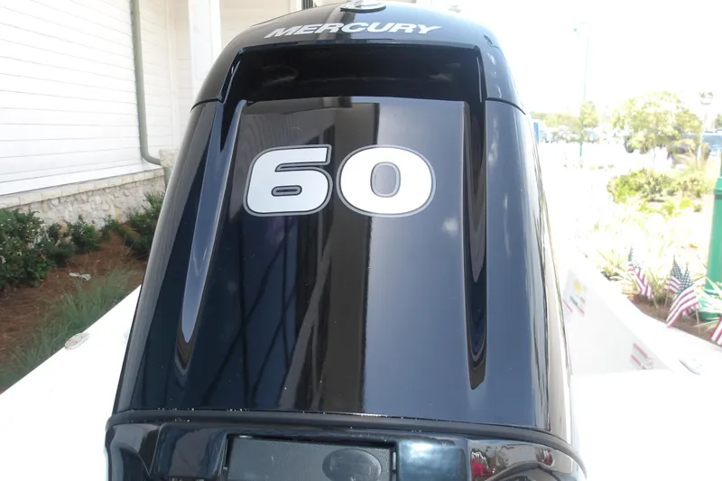 Slide: The Image of Mercury 60 horsepower outboard motor on 2026 Mako Pro Skiff 15 CC boat. - 59