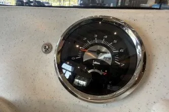 Slide: The Image of Close-up of a 2026 Mako Pro Skiff 13 CC boat tachometer gauge. - 9