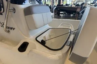 Slide: The Image of 2026 Mako Pro Skiff 13 CC boat interior with open storage compartment. - 12