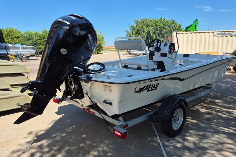 Slide: The Image of 2026 Mako Pro Skiff 17 CC boat on trailer with Mercury outboard motor. - 5
