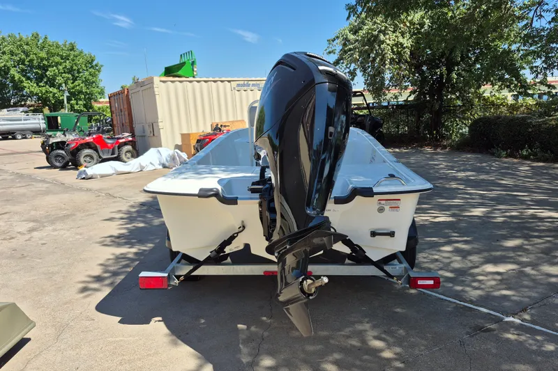 Slide: The Image of 2026 Mako Pro Skiff 17 CC boat on trailer, outdoor setting. - 6