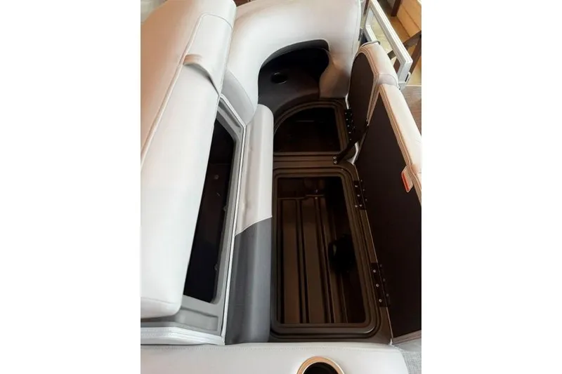 Slide: The Image of 2026 Sun Tracker SportFish 22 XP3 boat interior storage compartments open. - 7