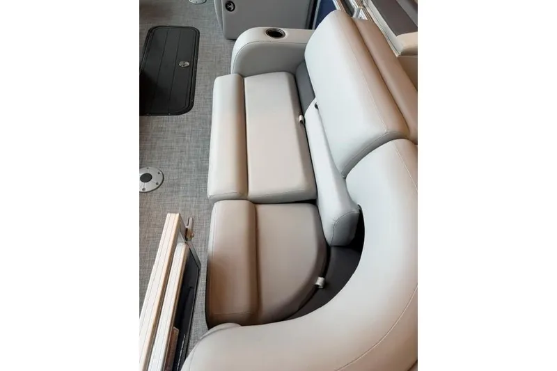 Slide: The Image of 2026 Sun Tracker SportFish 22 XP3 boat interior with gray cushioned seating. - 5