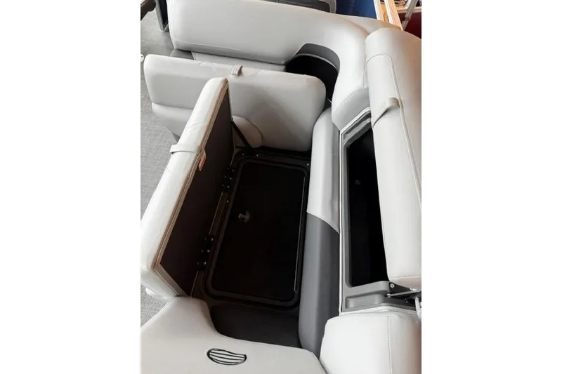 Slide: The Image of 2026 Sun Tracker SportFish 22 XP3 boat interior with open storage compartment. - 11